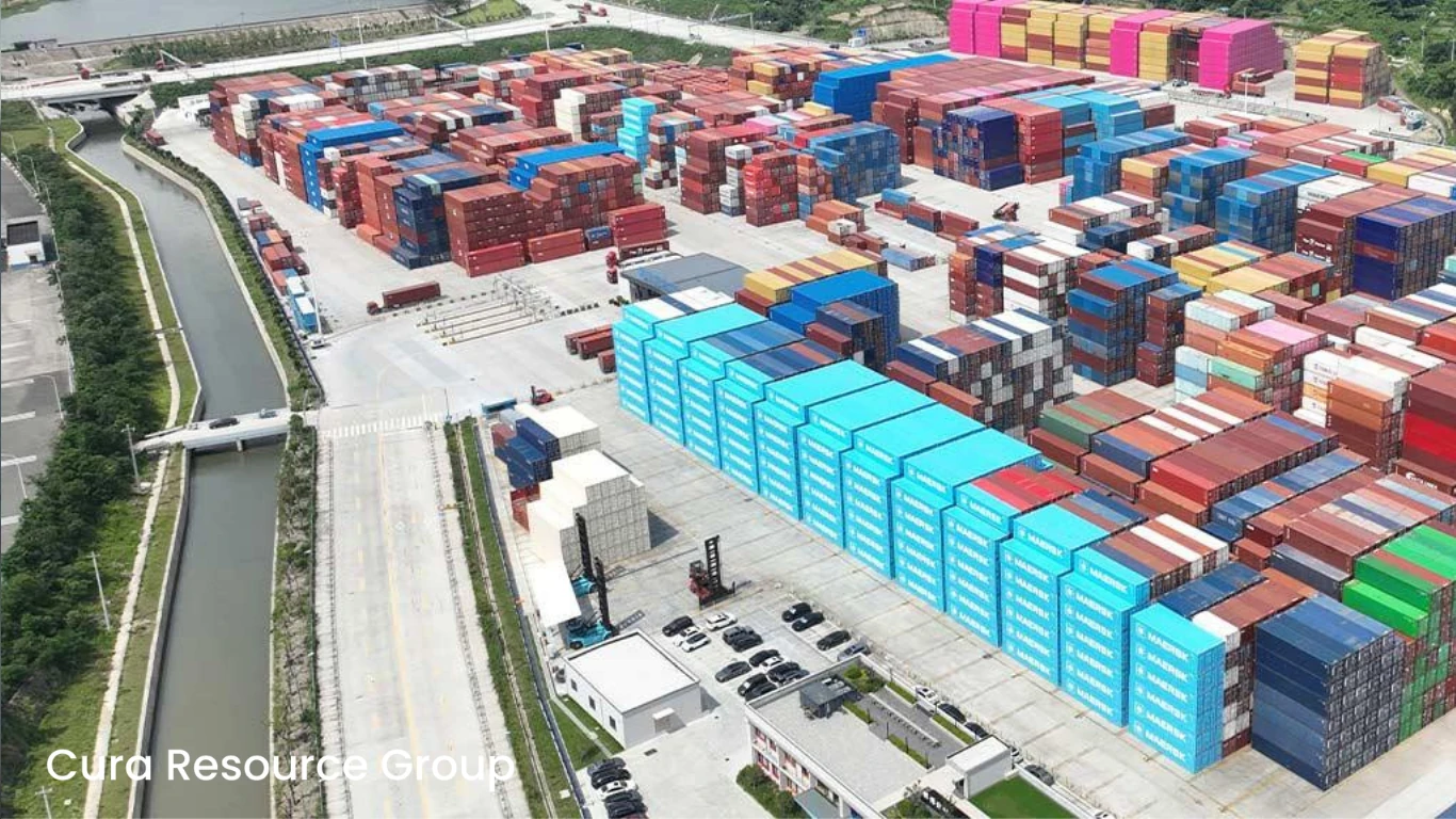 Stacked shipping containers at logistics yard near transit hubs for fast distribution
