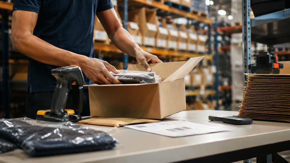 Worker picking and packing an order at a 3PL fulfillment center