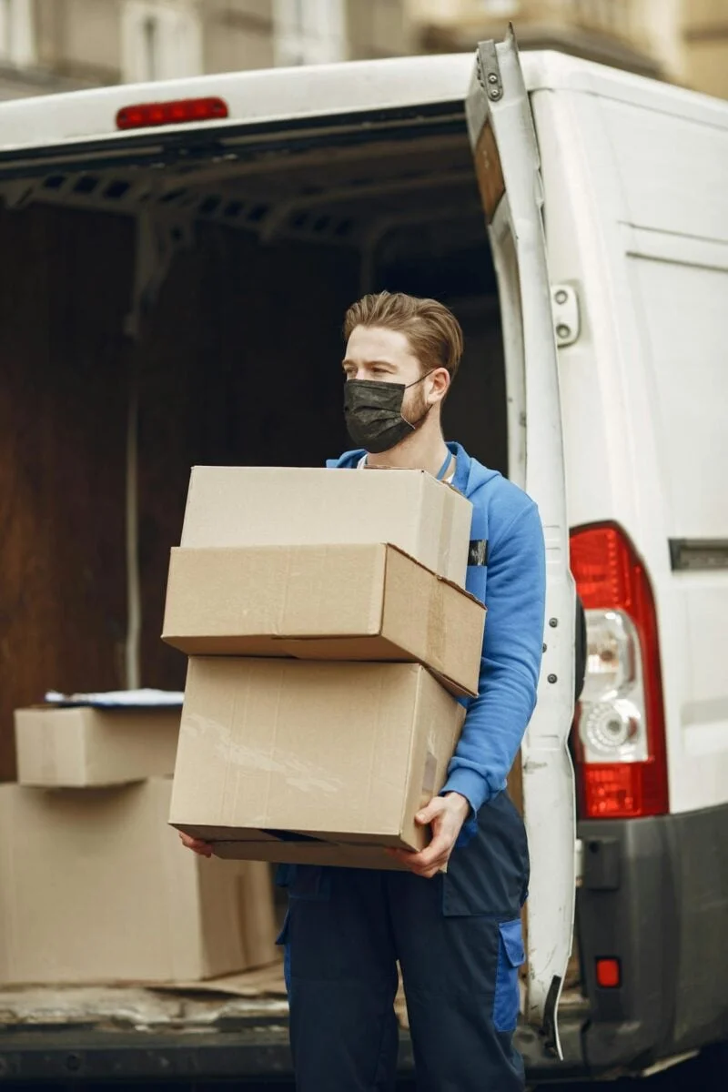 Logistics professional reviewing supply chain documents at a desk
